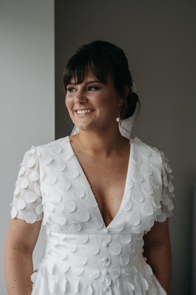 Bride smiling dress detail interior