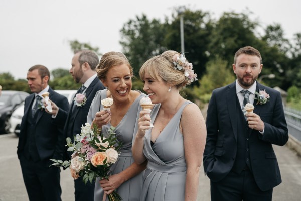 Family bridesmaids eating ice cream exterior