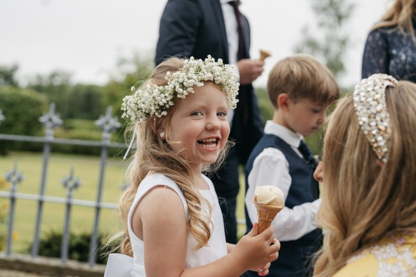 Little girl flower headband eating ice cream smiling little boy