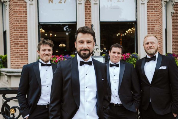 Groom and groomsman in tux