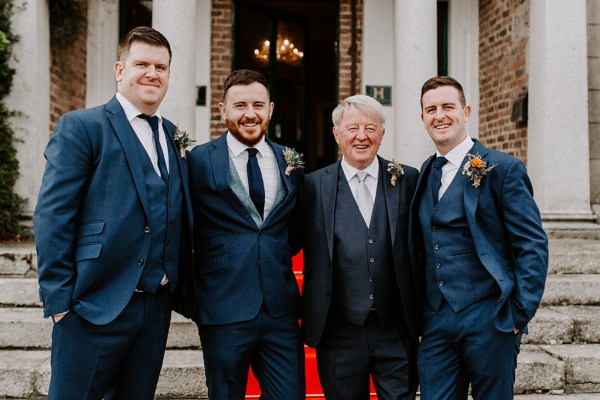 groomsmen and groom