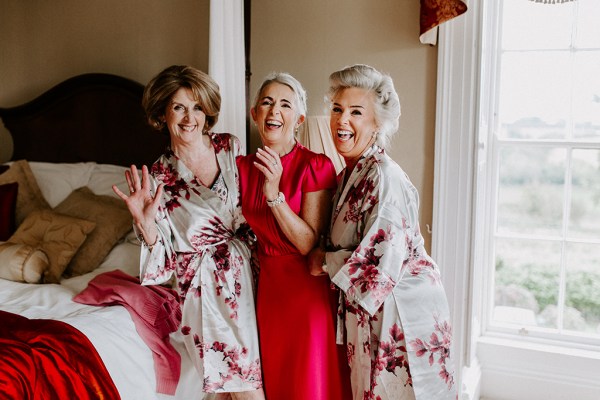 laughing bridesmaids in robes