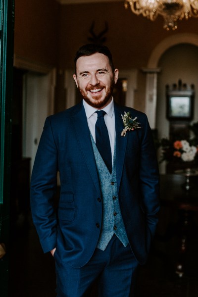 Happy groom navy suit