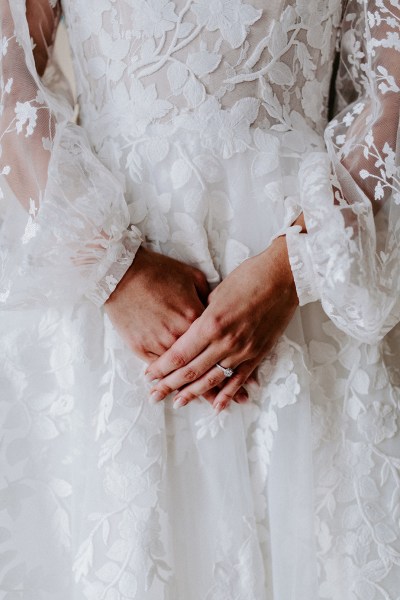 blonde bride in lace dress with sleeves