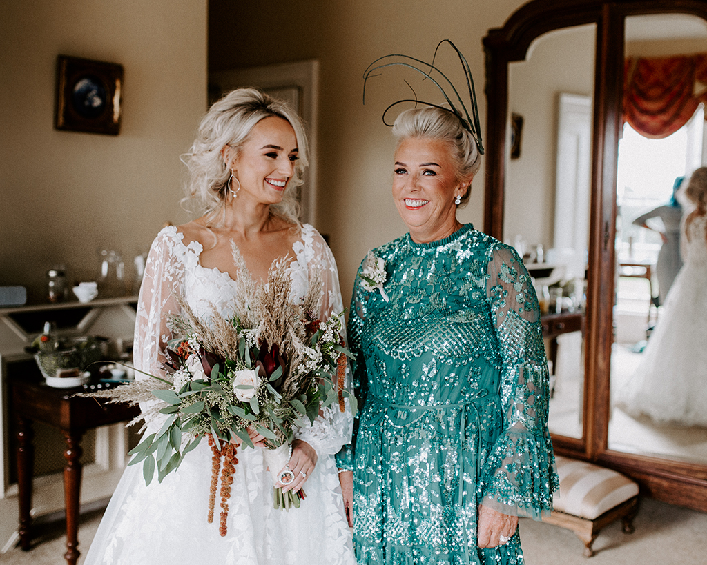 blonde bride in lace dress with sleeves