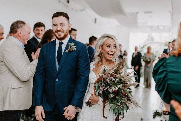 bride and groom walking down aisle