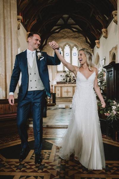 bride and groom leaving church