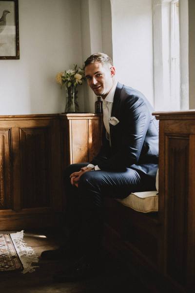 groom before wedding in suit