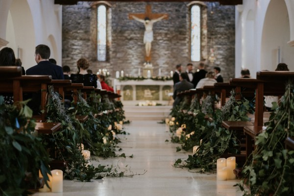 Ceremonial room pews and candles lit floor view