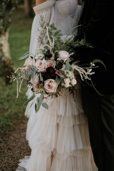 Close up of bouquet/roses flowers and groom