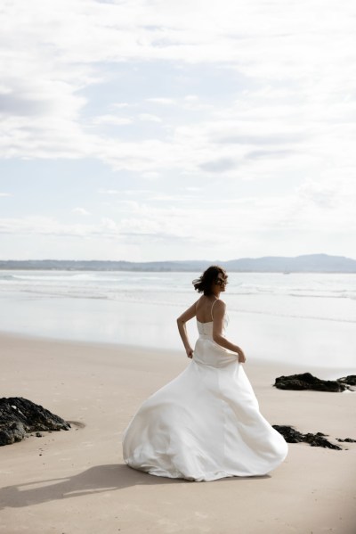 Bride running on beach silk wedding dress Karen Willis Holmes