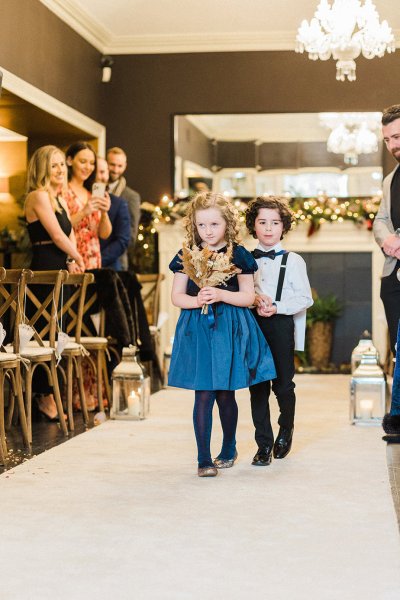 flower girl walking up the aisle