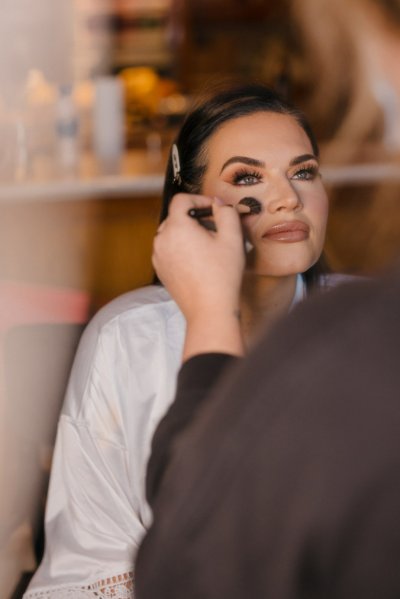 bride getting make up done