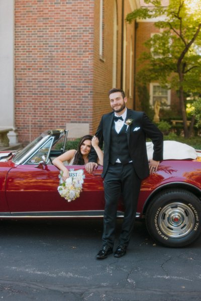 bride and groom wedding car red convertible