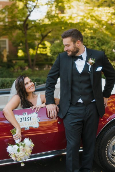 bride and groom wedding car red convertible