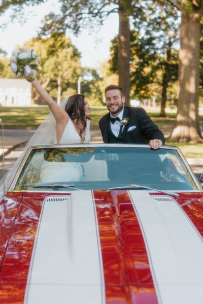 bride and groom wedding car red convertible