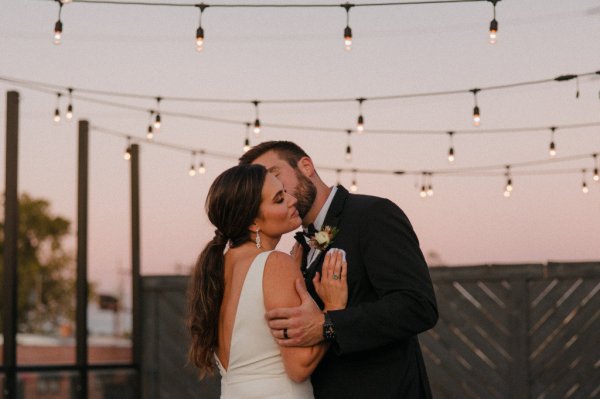 bride and groom lights outside