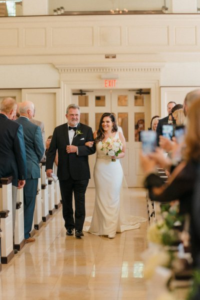 father walking bride down aisle