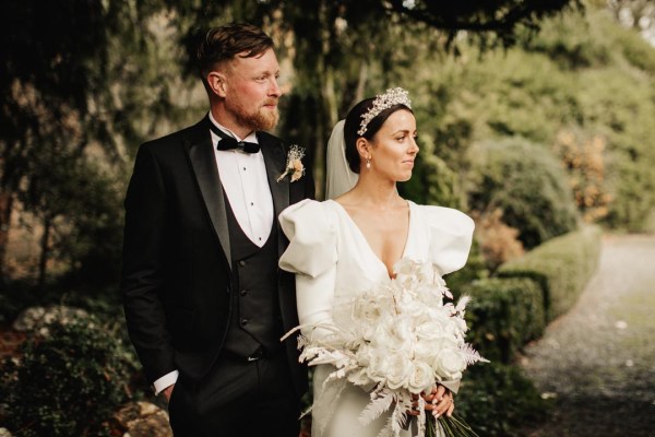 bride and groom black tuxedo long sleeve wedding dress