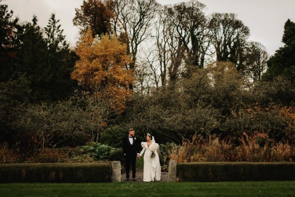 bride and groom black tuxedo long sleeve wedding dress