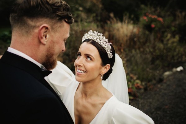 bride and groom black tuxedo long sleeve wedding dress