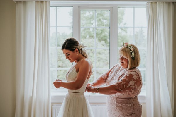 bride and mother getting ready and dressed