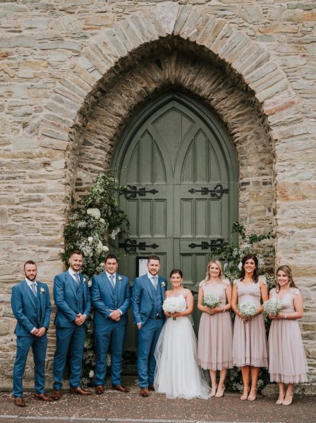 bridal party church entrance floral pillars