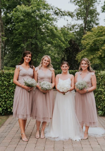 bride and blush bridesmaids