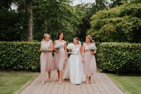 bride and blush bridesmaids