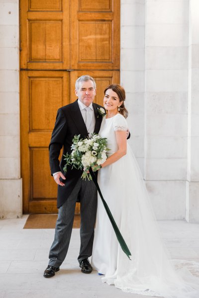 Father of the bride pose outside church