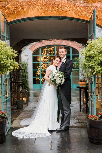 Trinity College church bride groom flowers veil college university Christmas venue