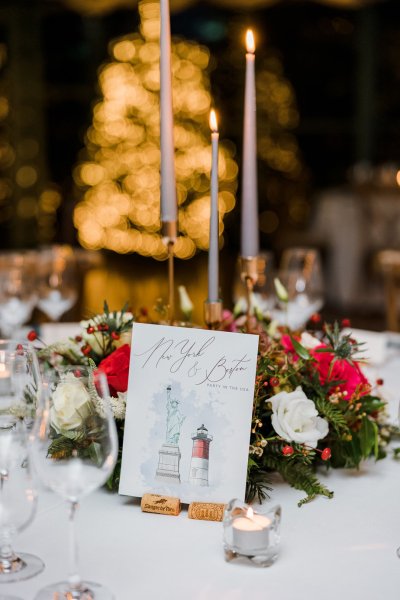 Interior autumnal dining room flowers cutlery champagne glasses letter note