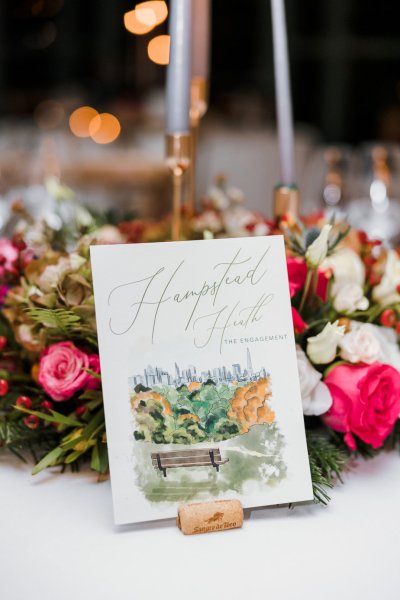 Interior autumnal dining room flowers cutlery champagne glasses letter note