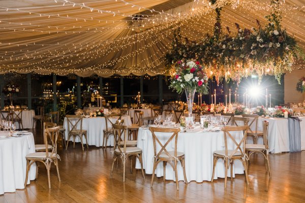 Interior autumnal dining room flowers cutlery candles