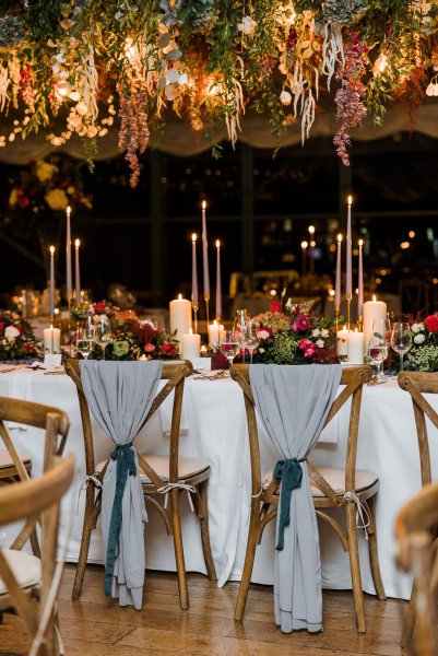 Interior autumnal dining room flowers cutlery candles