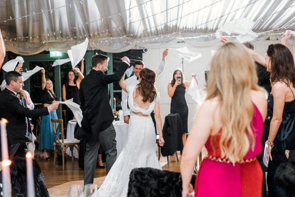 Bride groom guests clapping celebrating