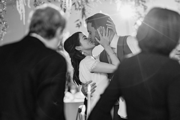 Black and white photography bride groom kiss