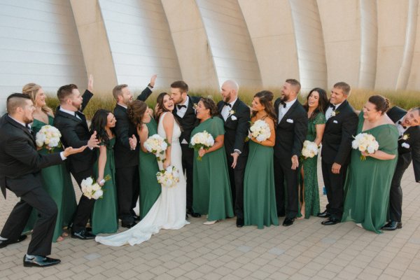 bridal party green bridesmaids and tuxedos