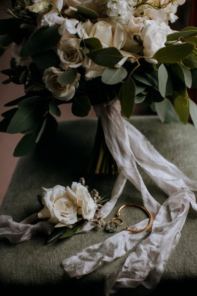 wedding rings and bouquet