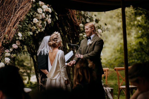 ceremony reading outdoor tipi wedding marquee vows bride and groom