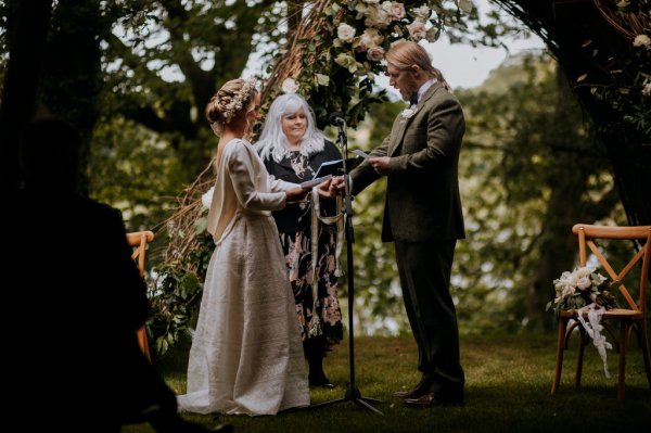 outdoor tipi wedding marquee bride and groom vows