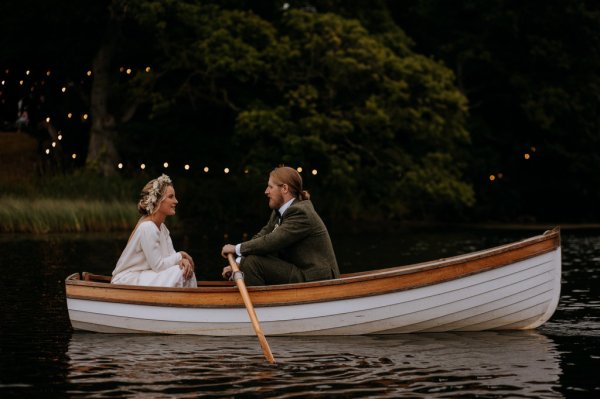 bride and groom paddle boat