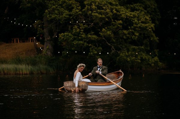 bride and groom paddle boat