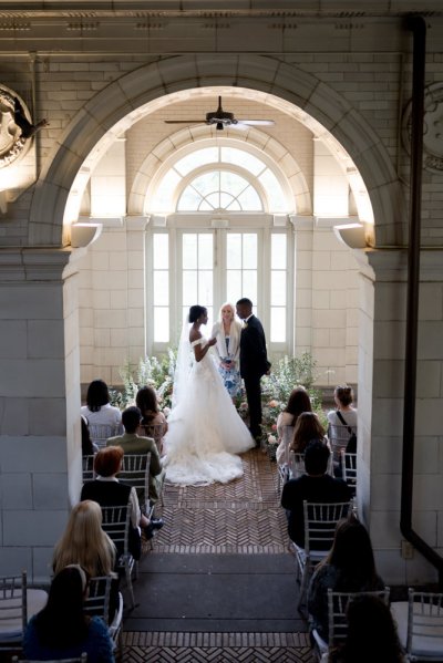 bride and groom at the alter guests wedding