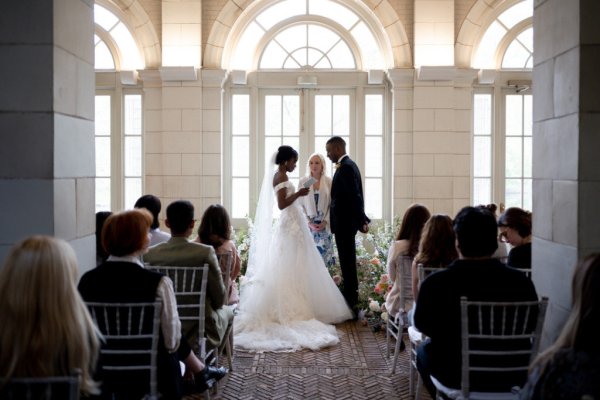 bride and groom at the alter guests wedding