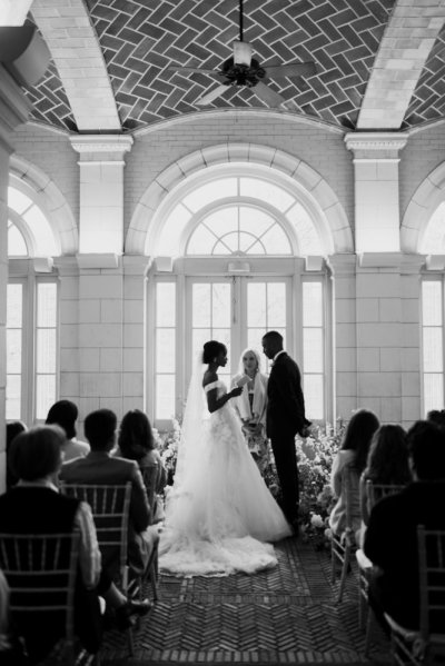 bride and groom at the alter guests wedding