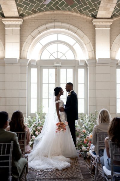 bride and groom at the alter guests wedding