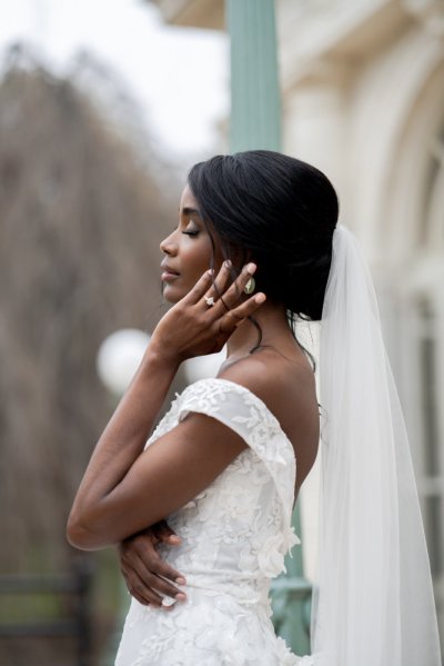 bride on her own exterior hotel pose