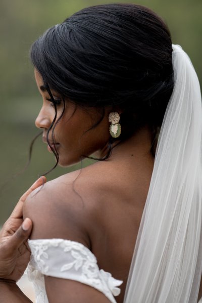 bride on her own exterior hotel pose