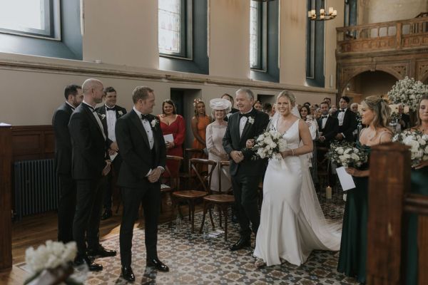 Father walking daughter bride down the aisle